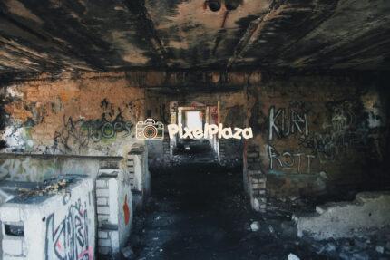 Abandoned Graffiti-Covered Building Corridor